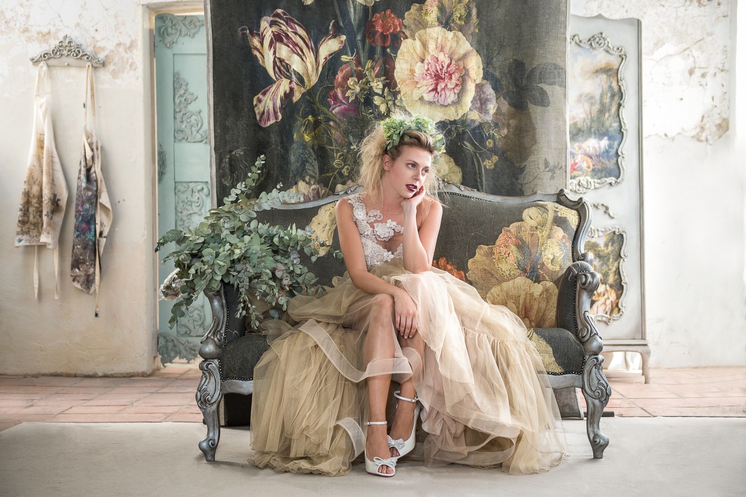 Fashion photography - Bride in champagne tulle gown on vintage floral couch
